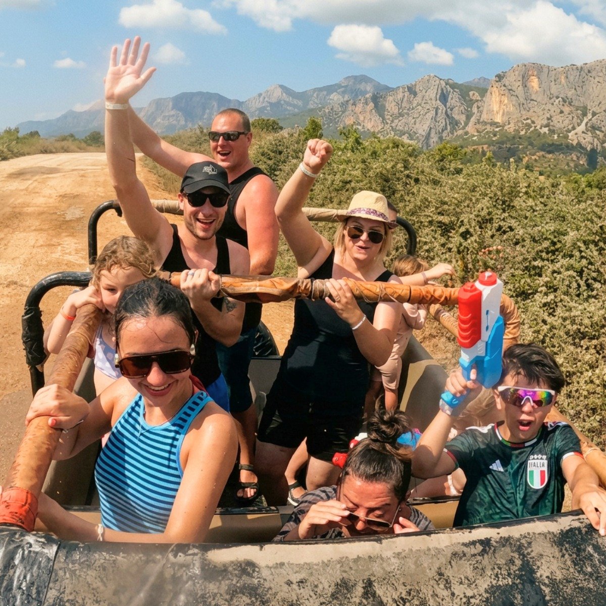 Happy guests waving in the back of a safari jeep