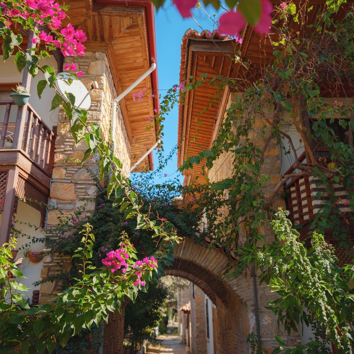 Traditional stone houses with bougainvillea in Kaleiçi
