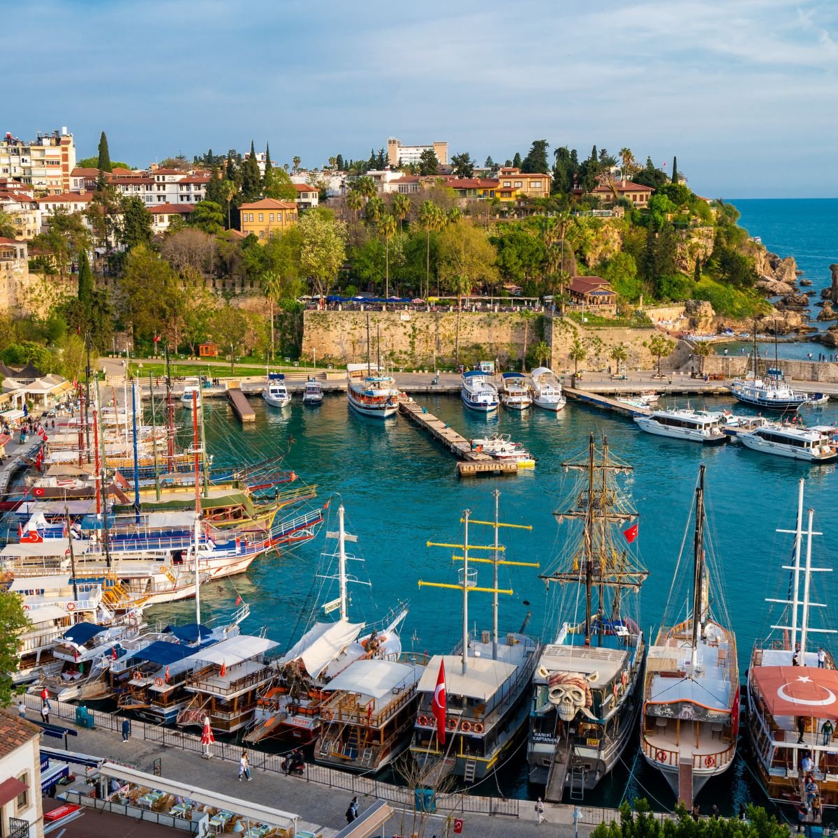 Antalya old harbor with boats and cliffs