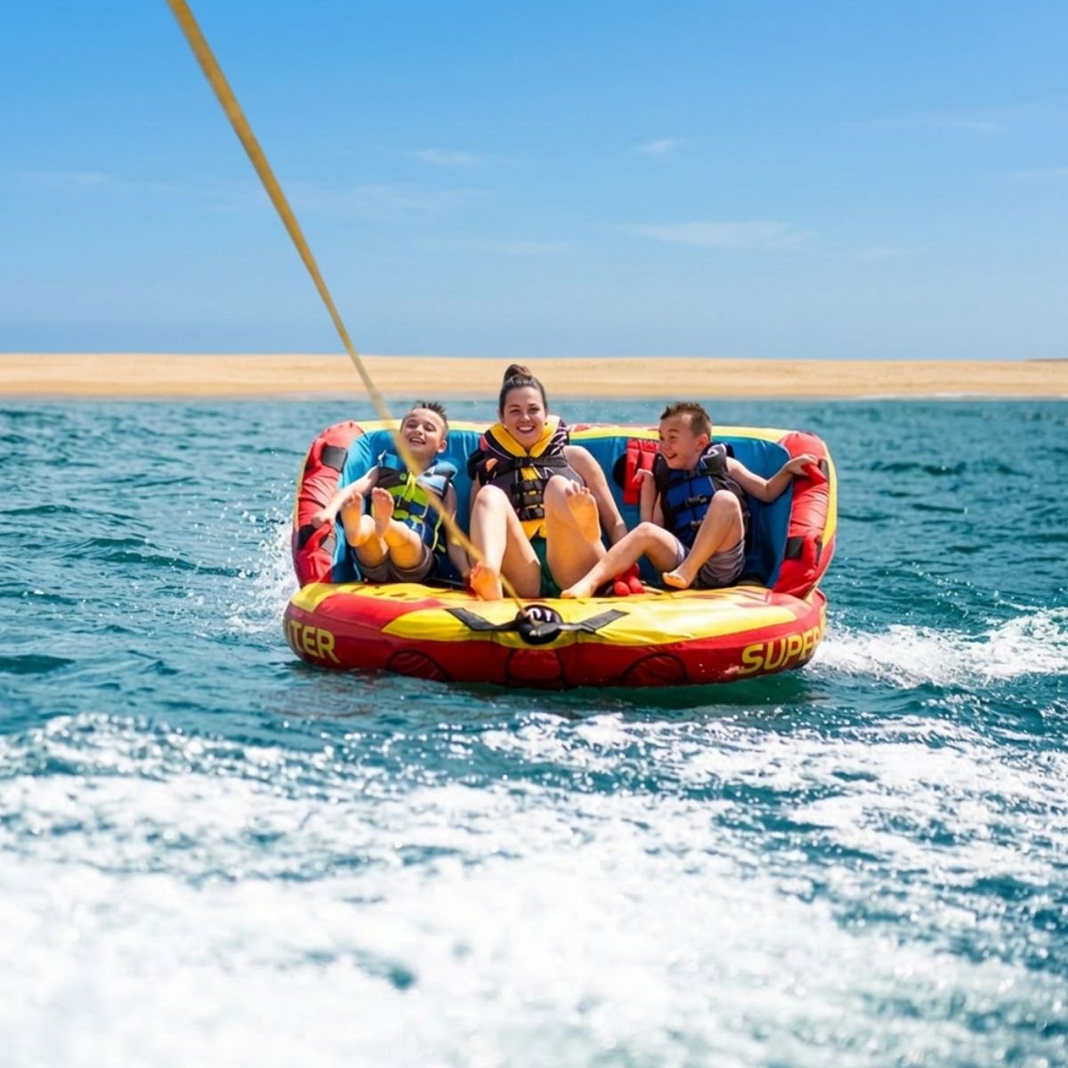 Family enjoying crazy sofa ride