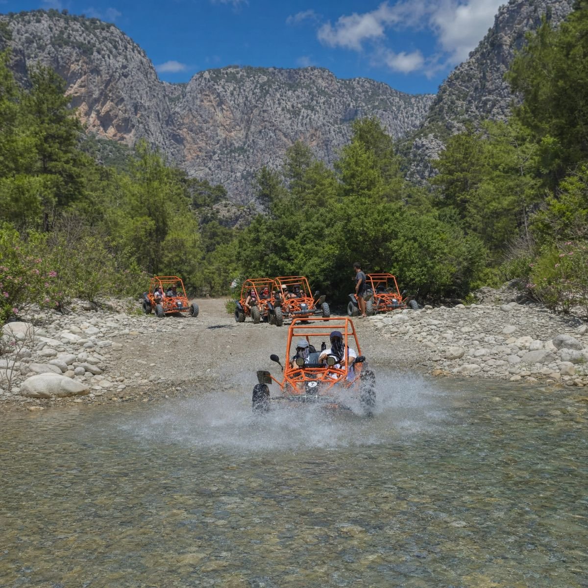 Buggy fleet crossing a river in Köprülü Canyon