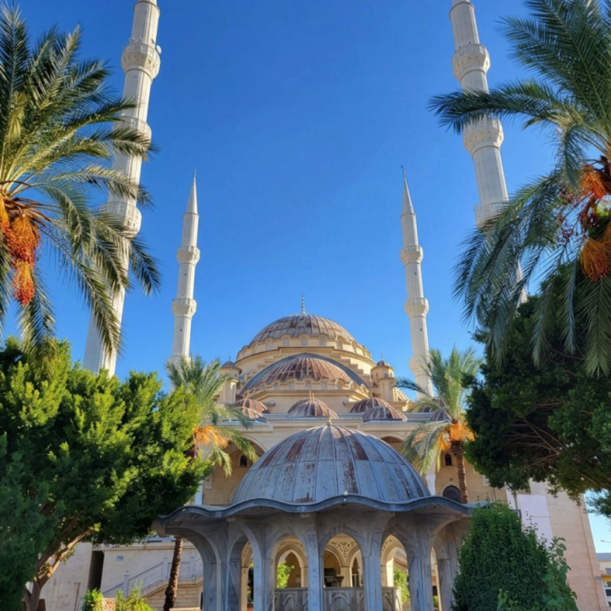 Külliye Mosque with minarets and palm trees