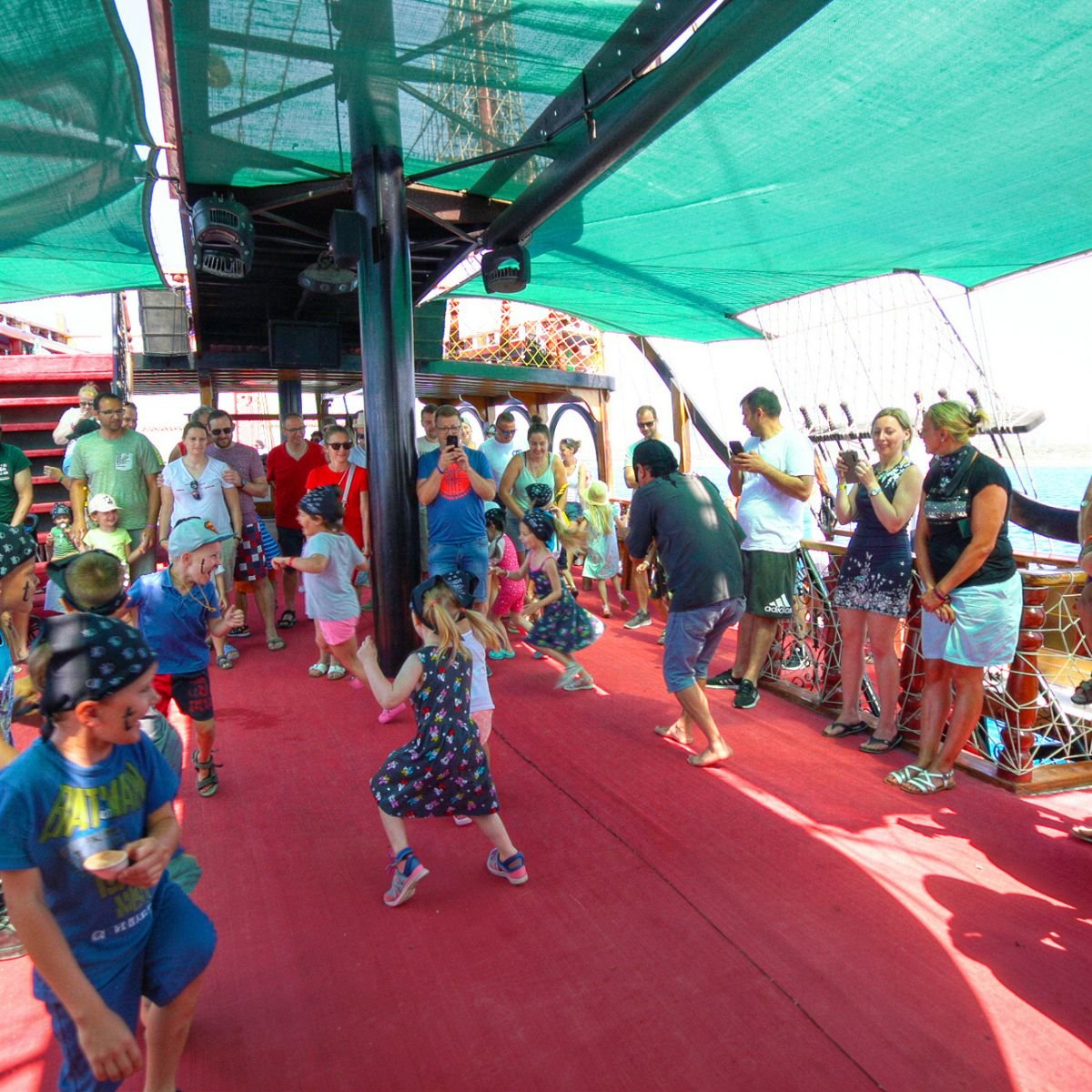 Guests dancing on deck during foam party