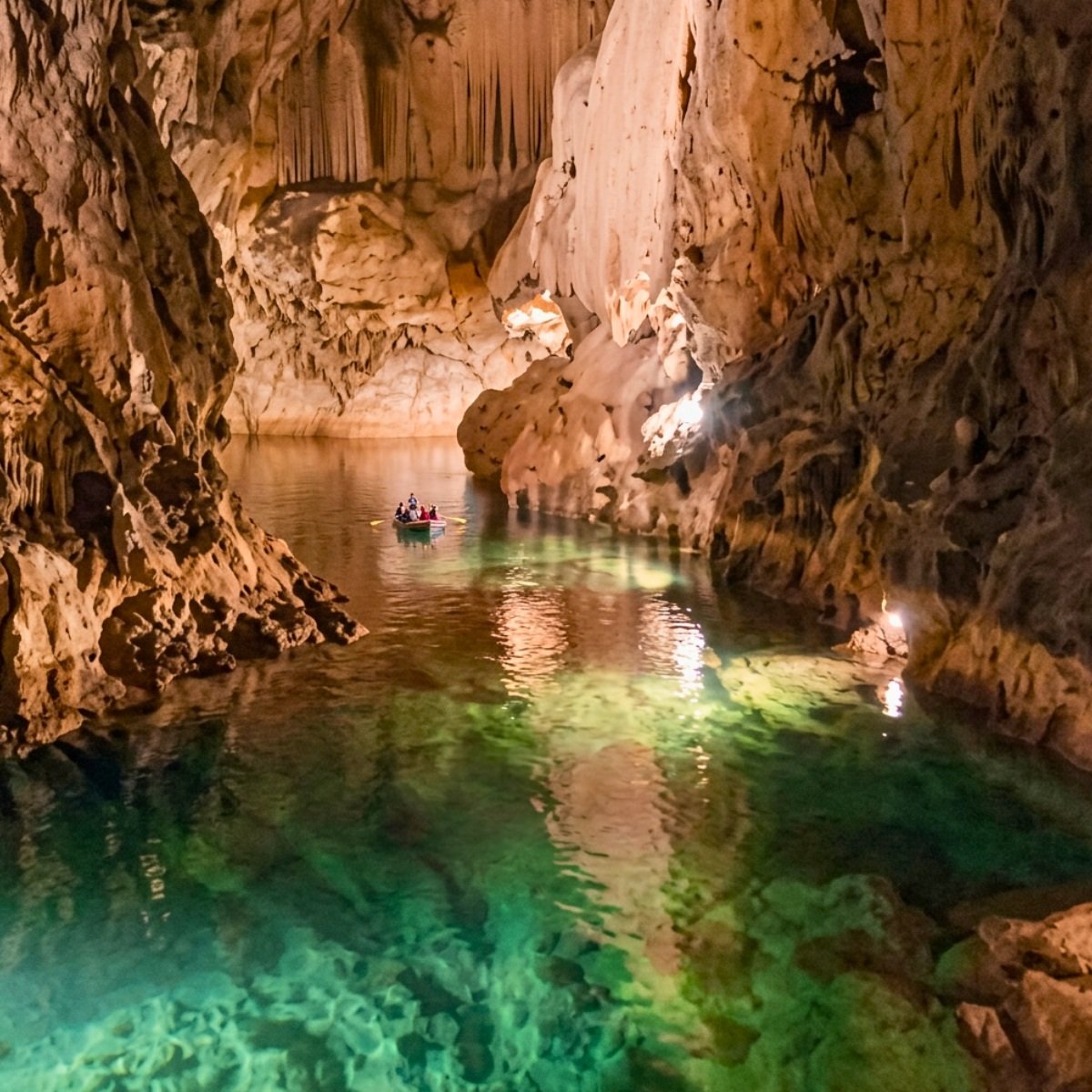 Altınbeşik Cave stalactites reflected in turquoise water