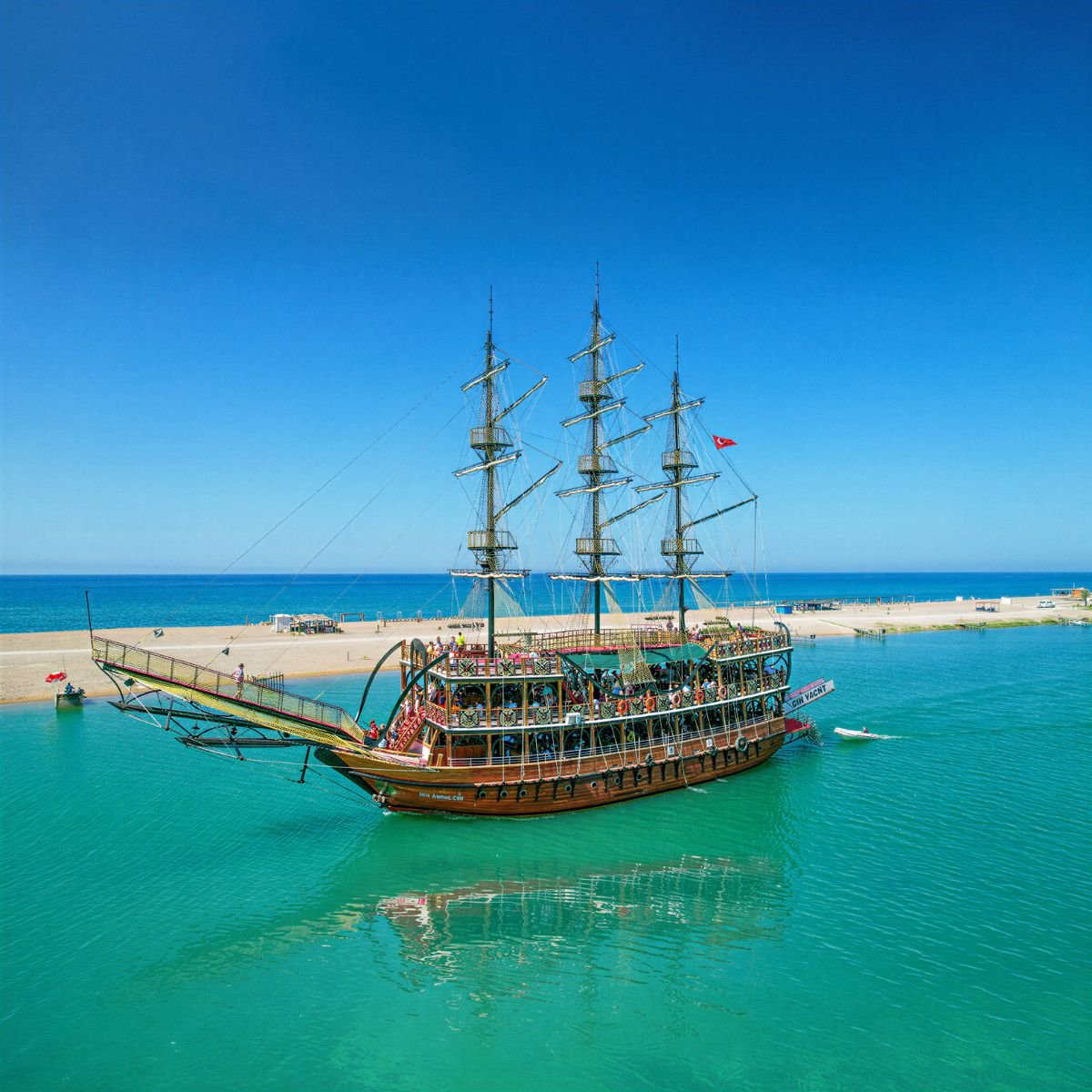 Pirate boat docked at sandy beach